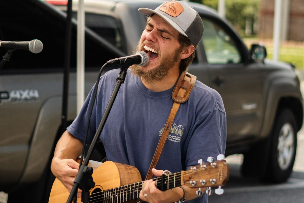 Musician Jimmy Clifton plays guitar and sings
