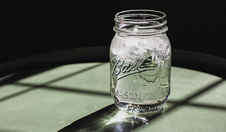 mason-jar-m-and-t-distilling mason jar in sunlight from window