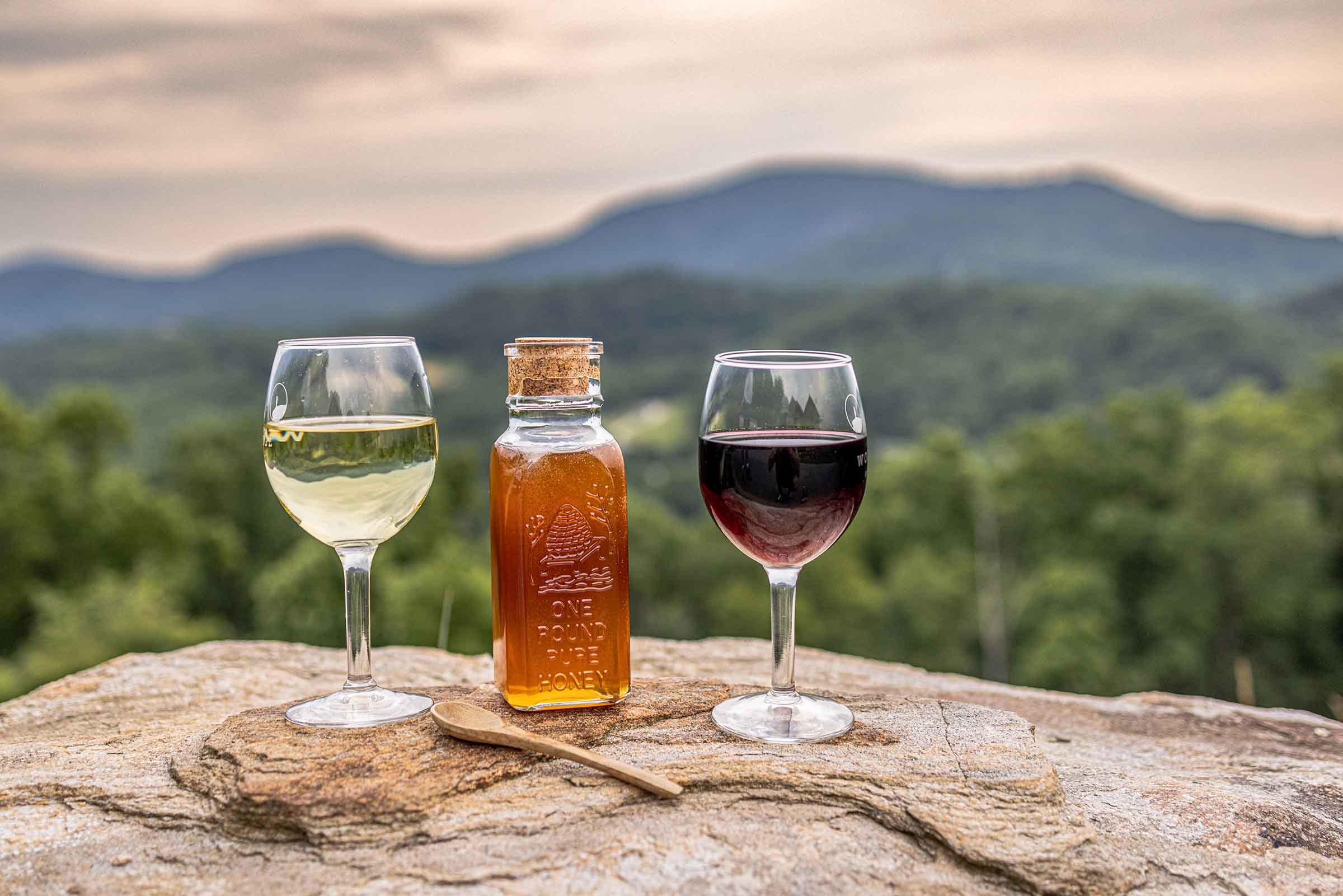 honey and mead in front of mountain scene