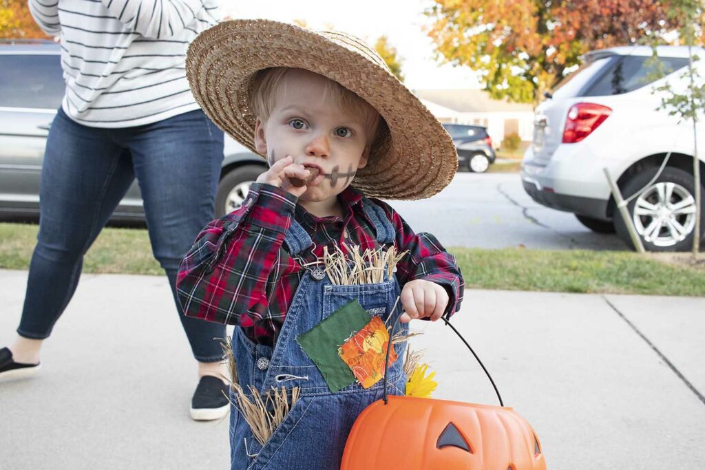 child dressed as scarecrow